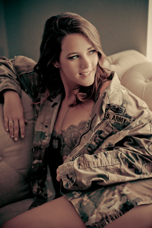Woman in military camo sitting on a couch